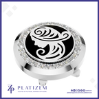A round silver-toned golf club headcover with a black center featuring a white stylized female profile design, surrounded by a border of clear rhinestones. The brand name 'PLATIZEM' is visible at the bottom of the image.