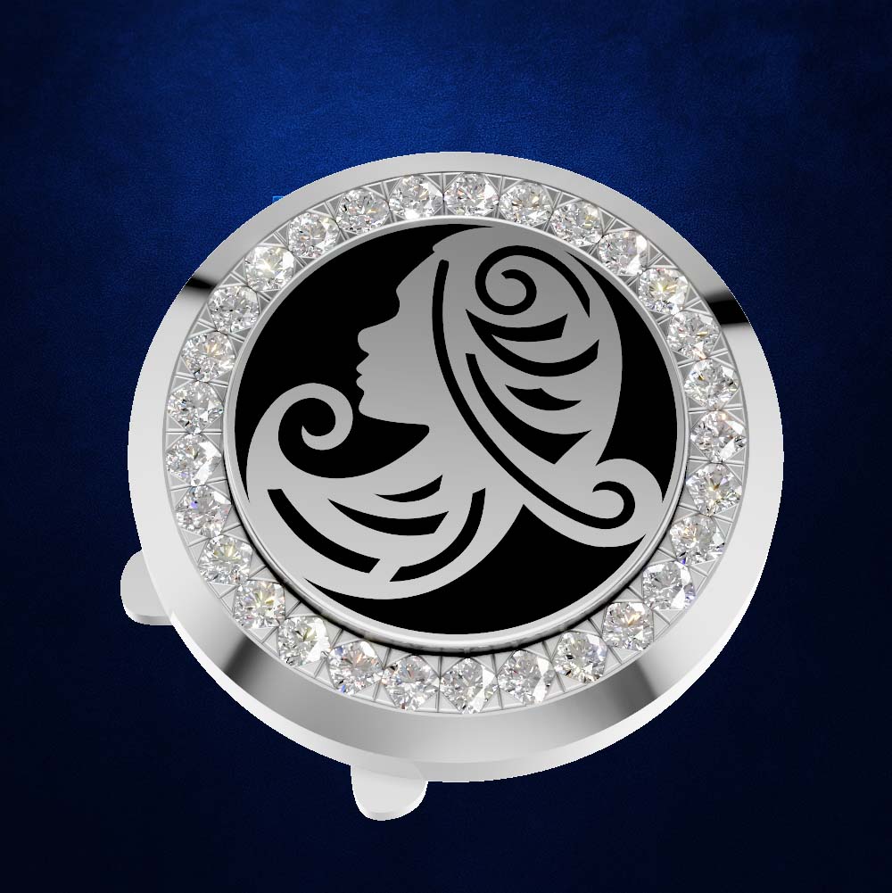 A round silver-toned car horn button or key fob cover featuring a black center with a silver filigree woman's profile design, surrounded by a border of clear rhinestones, set against a dark blue textured background.