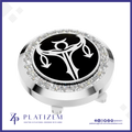 A round silver-toned golf ball marker with a black center featuring a white stylized golf hole symbol, surrounded by a halo of clear crystals. The brand name 'PLATIZEM' is visible at the bottom of the image.