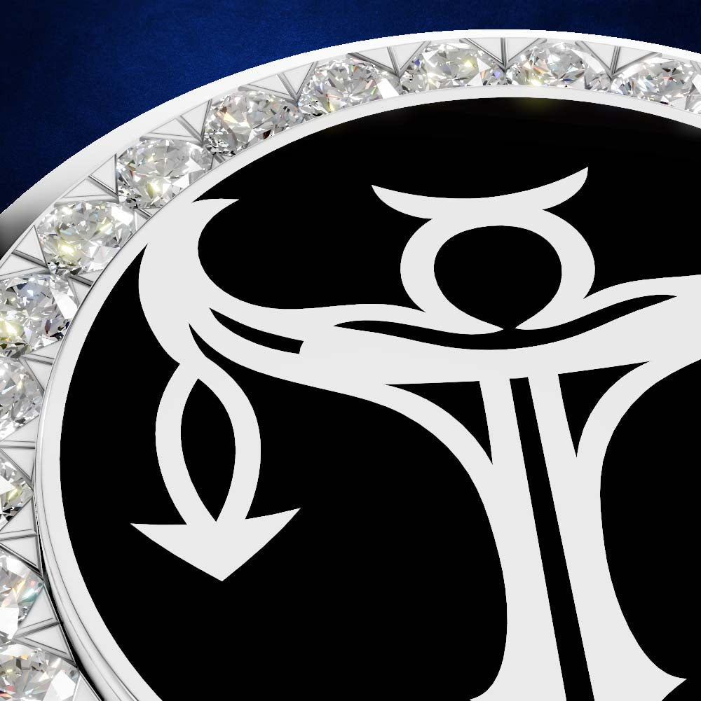 Close-up of a circular black pendant or medallion with a white stylized symbol in the center and a border of clear faceted gemstones on a dark blue background.