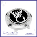 A round golf club headcover featuring a polished silver-tone metal bezel set with clear crystals, a central black circular insert with a white scorpion emblem, and a matching silver base. The brand name 'PLATIZEM' is visible at the bottom of the image.