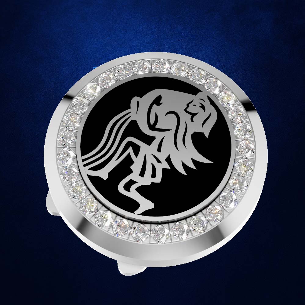 A round silver-toned ring holder or watch stand featuring a black center with a stylized lion emblem, surrounded by a border of clear rhinestones, set against a dark blue textured background.