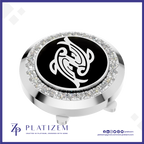 A round golf flagstick cap featuring a polished silver-tone bezel set with clear crystals, a black center disc with a white stylized animal emblem, and a threaded base. The brand name PLATIZEM is visible at the bottom of the image.
