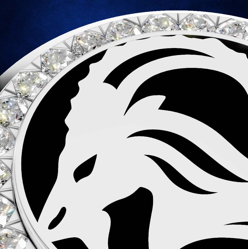 Close-up of a circular silver-toned jewelry piece featuring a bold black horse head emblem and a border of clear faceted gemstones on a dark blue background.