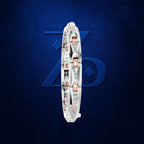 A white gold or platinum bangle bracelet with rose gold accents and pavé diamonds, shown vertically against a textured dark blue background with a subtle blue geometric logo.