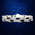 A geometric stretch bracelet featuring silver-toned rectangular links with pavé-set clear stones, alternating with black square inlays and rose gold cylindrical accents, displayed against a textured dark blue background with a stylized blue 'Z' logo.