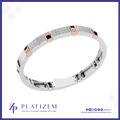 A white gold or platinum bracelet with pavé-set clear stones, rose gold accent squares, and small black inlays, shown on a white background with the Platizem brand logo at the bottom.