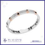 A white gold or platinum bracelet with pavé-set clear stones, rose gold accent squares, and small black inlays, shown on a white background with the Platizem brand logo at the bottom.