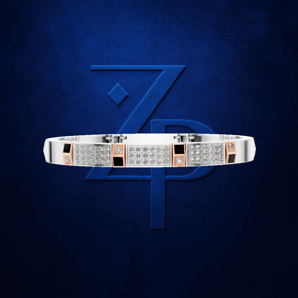 A silver-toned bangle bracelet with rows of clear pavé stones and rose gold square accents, displayed against a dark blue textured background with a large blue monogram.