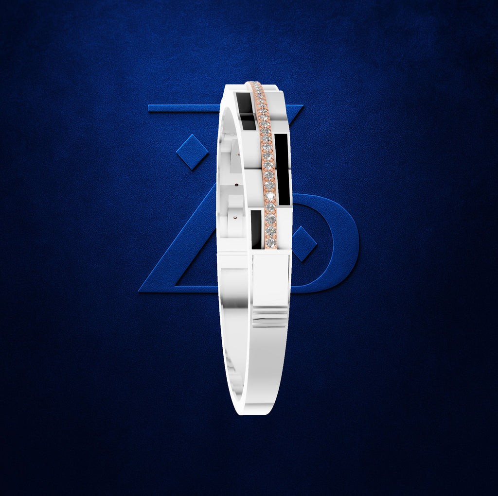 A white and black geometric bangle bracelet with a central rose gold diamond-studded stripe, displayed against a textured dark blue background with a subtle geometric logo.