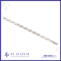 A slim white LED light strip with multiple rose gold/copper-colored lenses, shown diagonally on a white background with a blue border and the Platizem brand logo at the bottom.