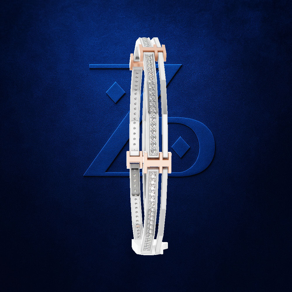 A pair of slim white leather bangles with silver-toned and rose gold metal trim, decorated with rows of clear pavé stones, displayed against a textured dark blue background with a subtle stylized logo.