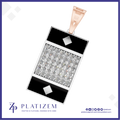 A rectangular pendant necklace from the brand PLATIZEM, featuring a central pavé diamond section bordered by black inlay and silver-toned metal. The pendant is suspended from a rose gold clasp, shown against a white background with a purple border and brand logo at the bottom.