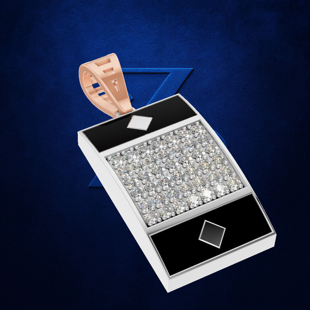 A rectangular pendant or box-like jewelry piece with a large center panel covered in clear stones, black end panels, silver-toned edges, and a rose-gold loop at the top, shown on a dark blue textured background.