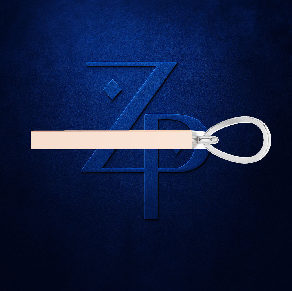 A pale blush pink leather strap with a silver metal ring and a matching blue embossed ZPD logo in the background.