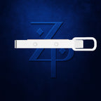 A white metal belt buckle with two circular rivet holes, shown horizontally against a textured dark blue background with a stylized blue 'ZP' logo.