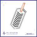 A rectangular pendant charm with a rose gold top loop, featuring a white center with a black chevron pattern and a border of clear rhinestones, shown on a white background with the brand name PLATIZEM at the bottom.