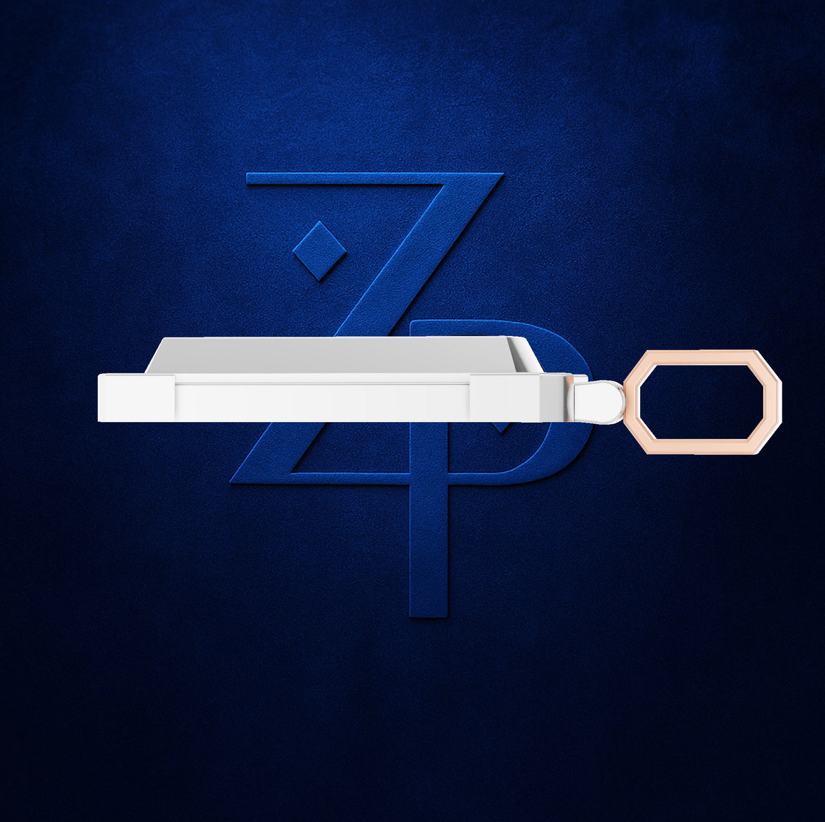 A white rectangular keychain or tag with a metallic rose-gold keyring, shown against a dark textured blue background with a stylized blue 'ZPD' logo.