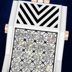 A close-up of a luxury watch featuring a white case, a geometric black chevron pattern on the upper half, and a grid of clear round diamonds on the lower half. Rose gold side lugs are visible against a dark blue background.