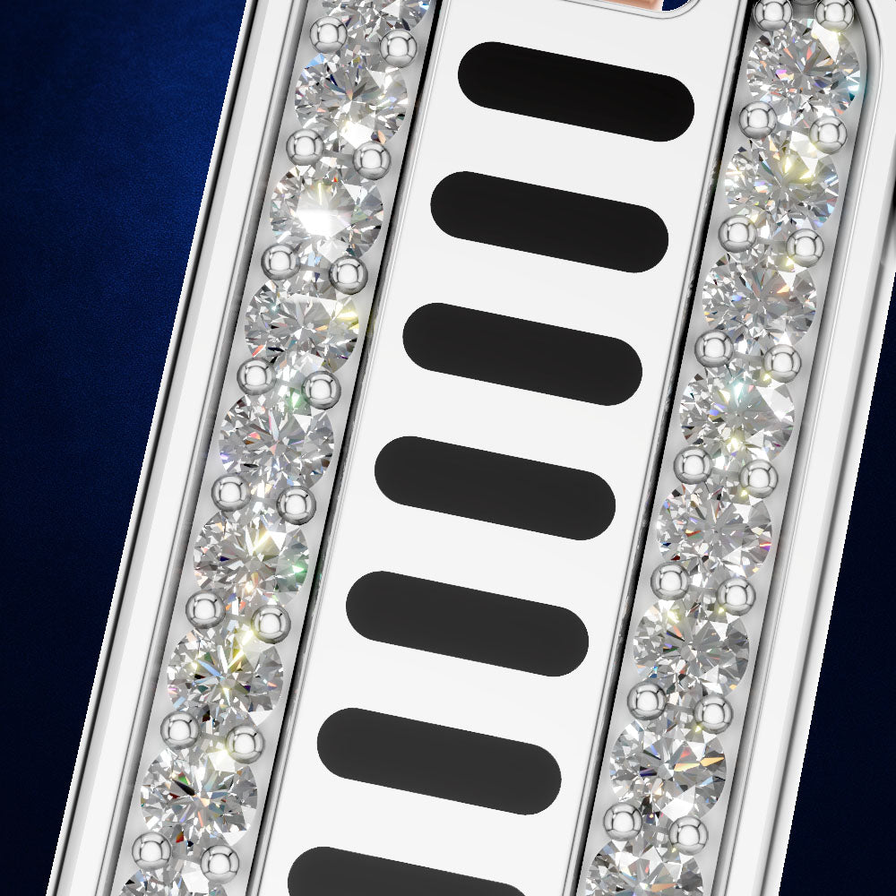 A close-up of a silver metallic accessory with a central white channel containing five black oval elements, flanked by two vertical rows of clear faceted rhinestones, set against a dark blue background.