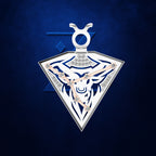 A triangular pendant necklace featuring a white and navy blue bull design with rose gold hands and small clear stones, set against a textured dark blue background.