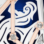 Close-up of a luxury watch dial featuring a bold navy blue and white Art Deco design with rose gold accents and clear crystal gemstones.