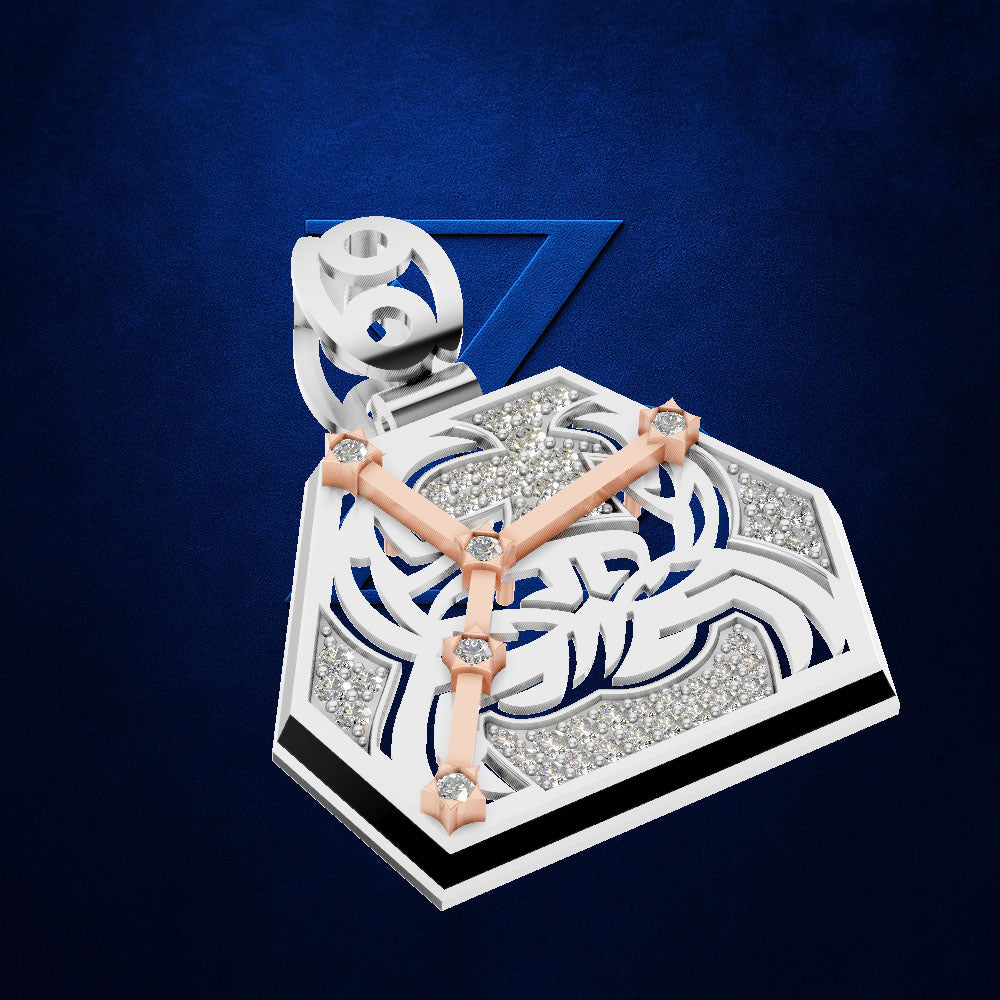 A geometric pendant necklace featuring a white and rose gold triangular design with inlaid clear crystals, suspended from a silver bail, set against a textured dark blue background.