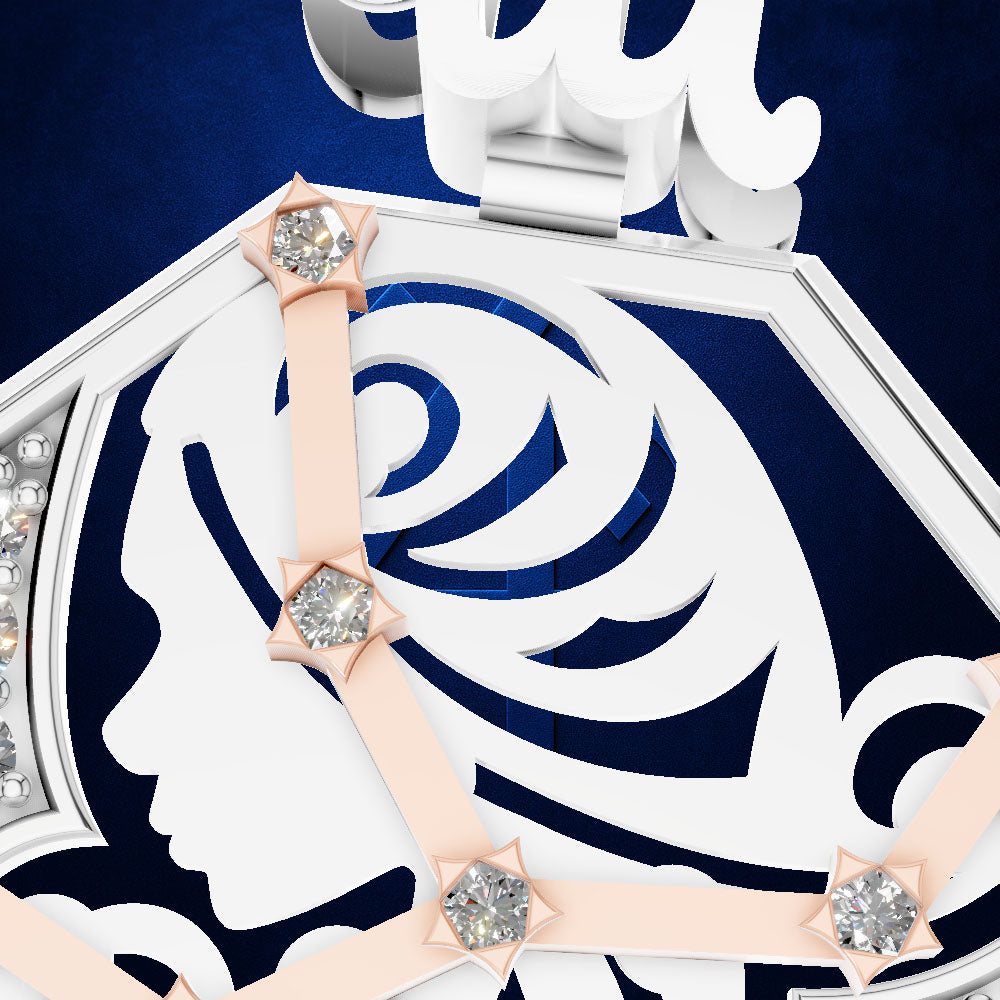 Close-up of a white and navy blue jewelry box lid featuring a stylized profile of a woman's face, a rose motif, and pale pink ribbon accents tied with clear crystal star-shaped bows, set against a dark blue background.