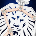 Close-up of a white and navy blue geometric pendant or brooch featuring a stylized lion face cutout, accented with rose gold bars and clear gemstones on a dark blue background.