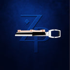 A 3D-rendered keycap set featuring a large white keycap with a silver split shank and rose gold switches, displayed horizontally in front of a stylized blue 'ZPD' monogram logo on a dark textured blue background.