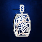 A luxury watch pendant featuring a white and navy blue zodiac symbol of Libra, accented with rose gold hands and diamond-like crystal details, set against a textured dark blue background.