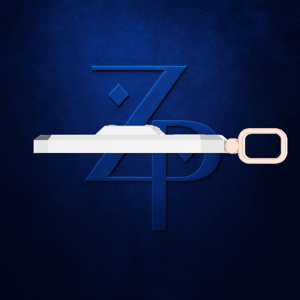 A white rectangular bar with a rose gold oval ring, shown horizontally against a textured dark blue background with a stylized blue 'ZP' logo.