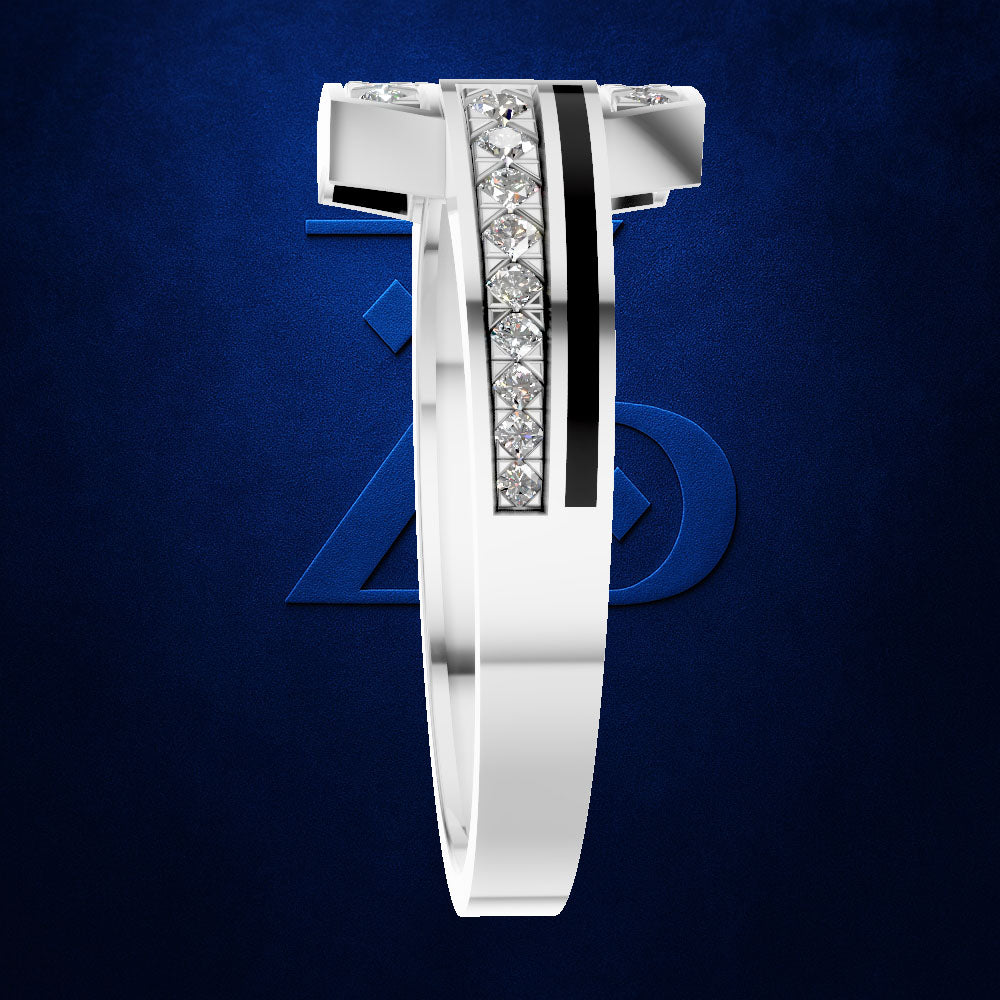 A silver-toned men's ring with a bold geometric design, featuring a central channel set with clear pavé stones and a vertical black inlay, shown against a dark blue textured background with a subtle Avengers logo.