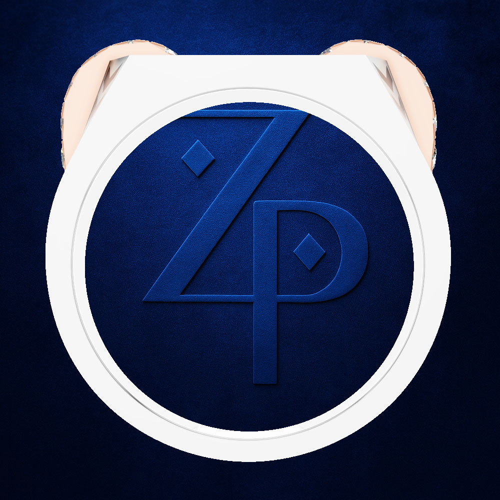 A circular white cosmetic compact or powder pan with a dark blue textured center and a stylized embossed 'ZP' logo, shown against a dark blue background.