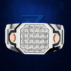 A futuristic octagonal ring featuring a large grid of clear cubic zirconia stones in the center, flanked by two rose gold hexagonal accents on a silver-toned band with black geometric detailing, set against a textured dark blue background.
