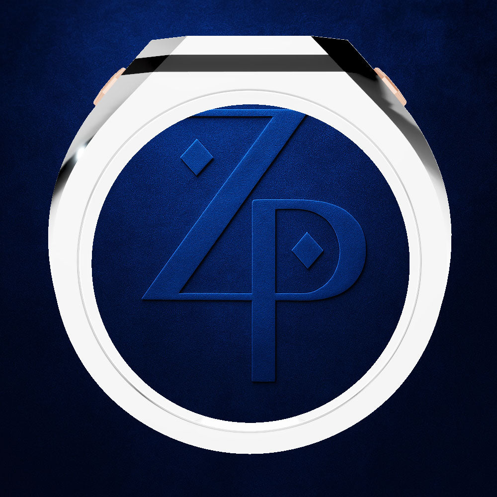 A close-up of a round watch face with a white bezel and a dark blue dial featuring an embossed stylized 'ZP' monogram, shown against a dark blue textured background.