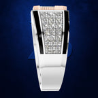 A silver-toned bangle watch with a rectangular face paved with clear crystals, flanked by black inlays and a pink top bezel, set against a dark blue textured background.