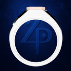 A round white and black ring with a pale pink band, featuring a dark blue recessed center with an embossed stylized '4P' monogram, set against a textured dark blue background.
