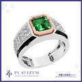 A platinum ring featuring a large emerald-cut green gemstone in a rose gold bezel, with diamond-set shoulders on a white background with the Platinzem brand logo.