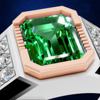 A close-up of a ring featuring a large emerald-cut green gemstone in a rose gold bezel setting, with small clear stones along the shoulders, shown against a dark blue background.
