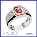 A platinum ring featuring a large emerald-cut pink gemstone in a rose gold bezel, set on a silver-toned band with pavé-set clear stones. The brand logo 'PLATIZEM' is visible at the bottom.