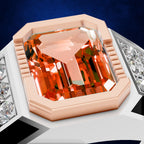 A close-up of a ring featuring a large, faceted orange gemstone in a rose gold bezel setting, flanked by rows of small clear stones on a white band, set against a dark blue background.