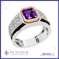 A platinum ring featuring a large emerald-cut purple amethyst center stone, a rose gold octagonal bezel, and pavé-set clear crystals along a split band, shown on a white background with the Platiszem brand logo.