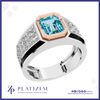 A platinum ring featuring a large emerald-cut light blue gemstone in a rose gold bezel, with a silver pavé-set band accented by black inlays. The brand logo 'PLATIZEM' is visible at the bottom.