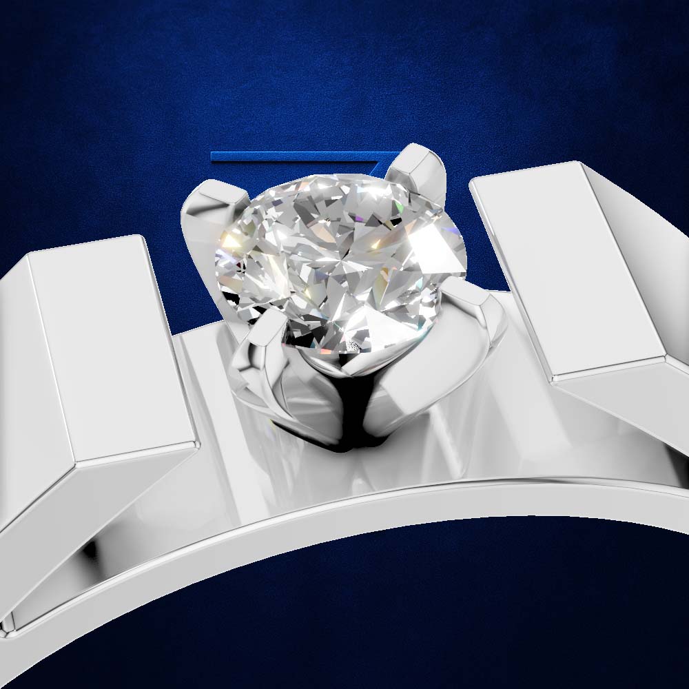 A close-up studio shot of a solitaire engagement ring with a round brilliant-cut diamond set in a polished silver-colored band, presented on a dark textured blue background.