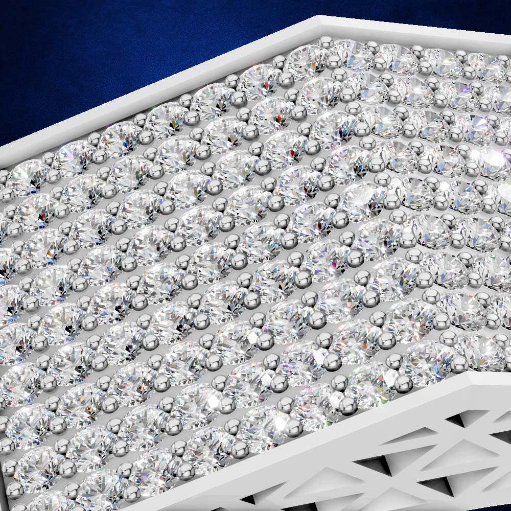 A close-up of a white geometric display tray filled with many clear faceted gemstones arranged in rows against a dark blue background.
