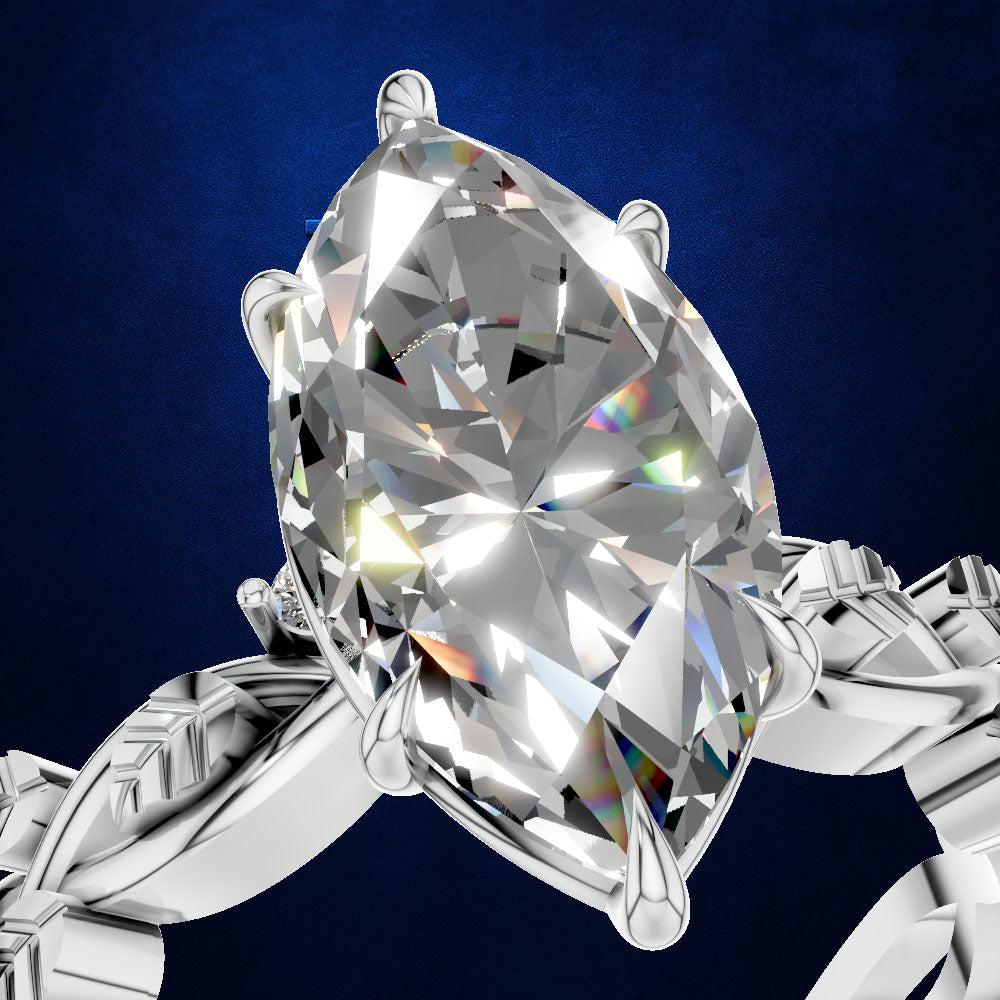 A close-up of a silver-toned ring featuring a large marquise-cut clear gemstone in a prong setting, shown against a dark blue textured background.