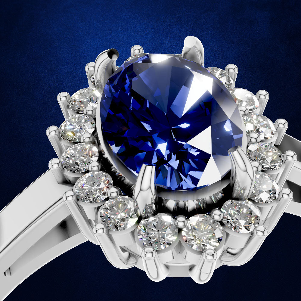 A close-up studio shot of a silver-toned ring featuring a large round brilliant-cut deep blue sapphire center stone surrounded by a halo of small clear round-cut diamonds, set against a dark blue background.