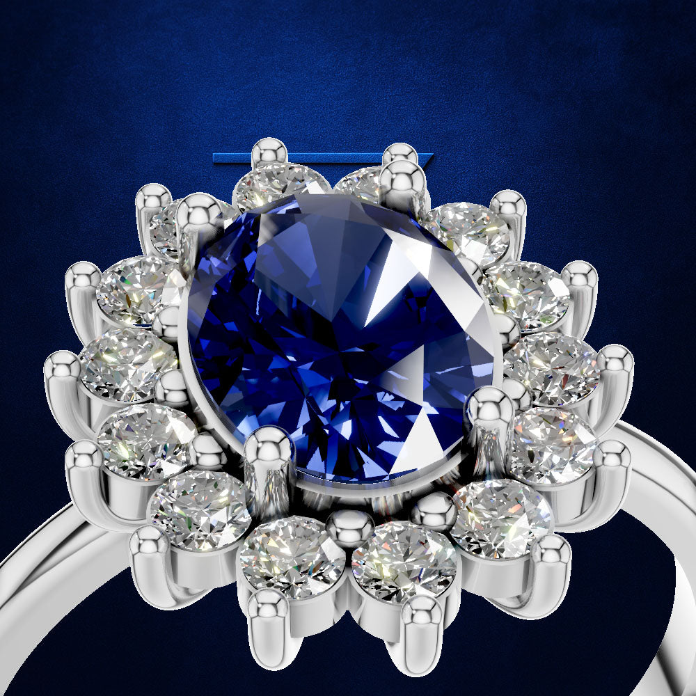 A close-up shot of a silver-toned ring featuring a large oval-cut deep blue gemstone surrounded by a halo of round clear stones, set against a dark blue textured background.