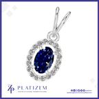 A silver pendant featuring a marquise-cut deep blue sapphire center stone surrounded by a halo of small clear stones, shown on a white background with the Platizem brand logo at the bottom.